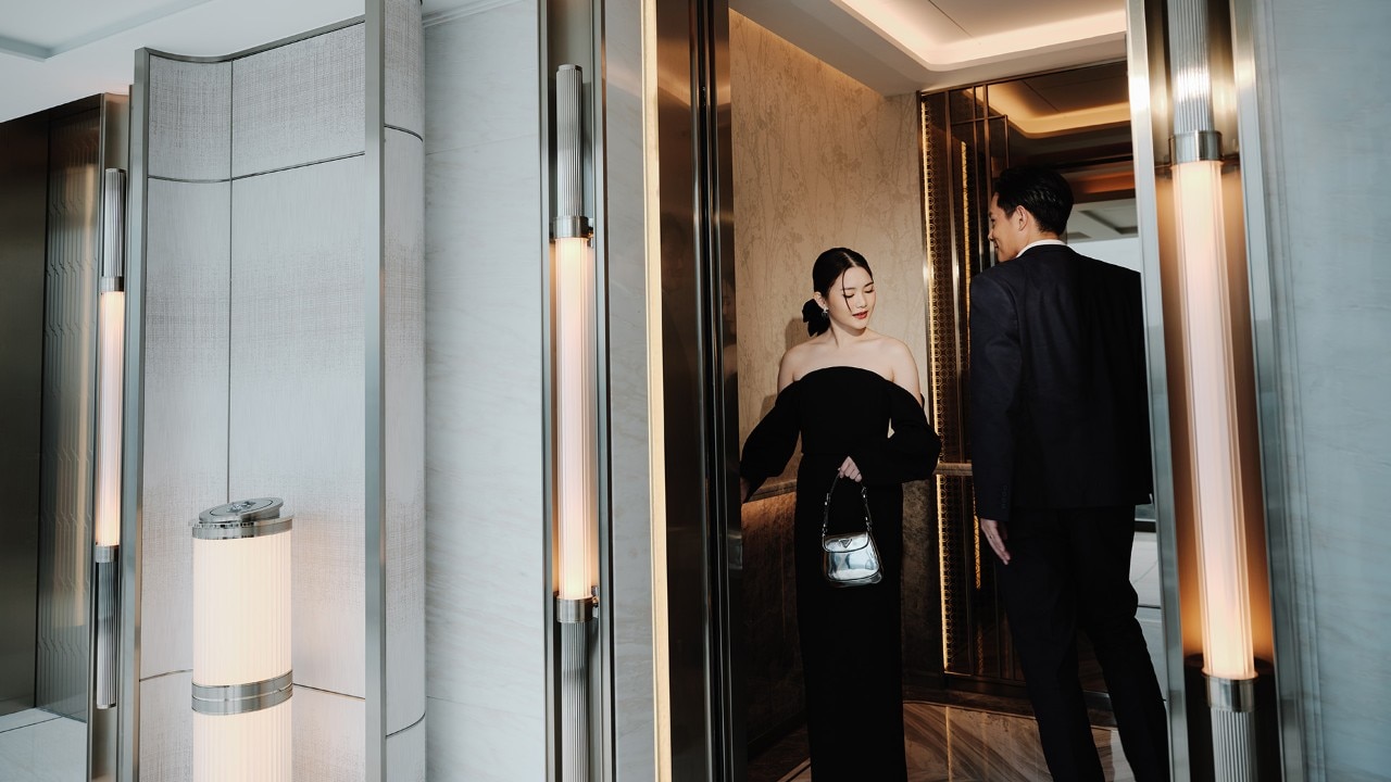 Couple in luxury hotel lift
