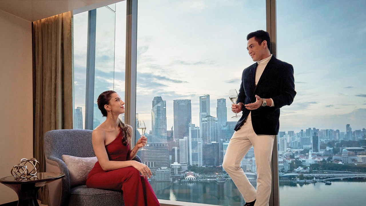 Couple having drinks in a suite