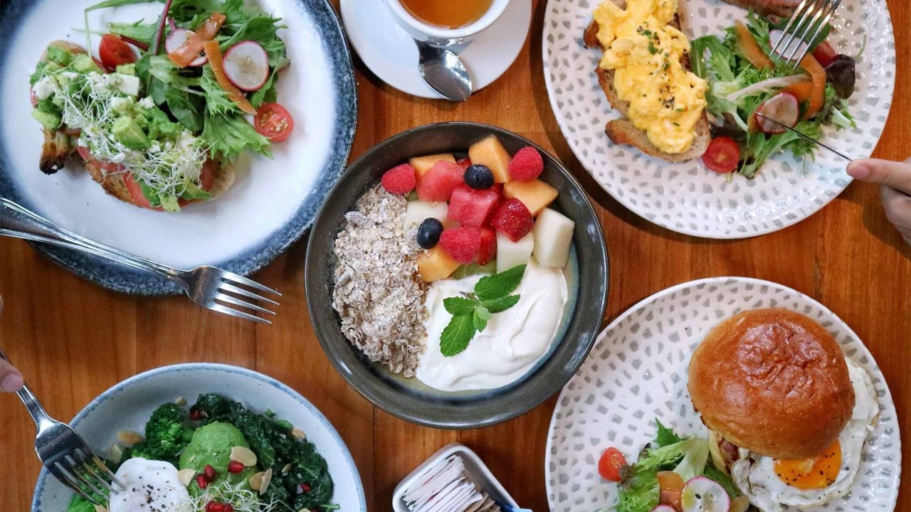 Toast and acai bowl for brunch at Dallas Cafe & Bar, overseeing an instagram worthy place in Singapore