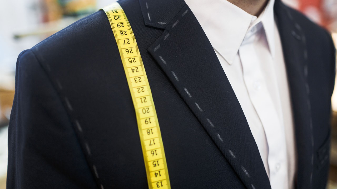 Fashion mood board with man getting a tailored suit at luxury fashion brands in Singapore