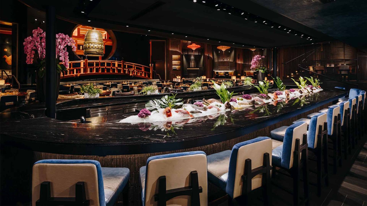 A bell with bright orange pillars at KOMA Singapore, the most instagrammable restaurant in Singapore
