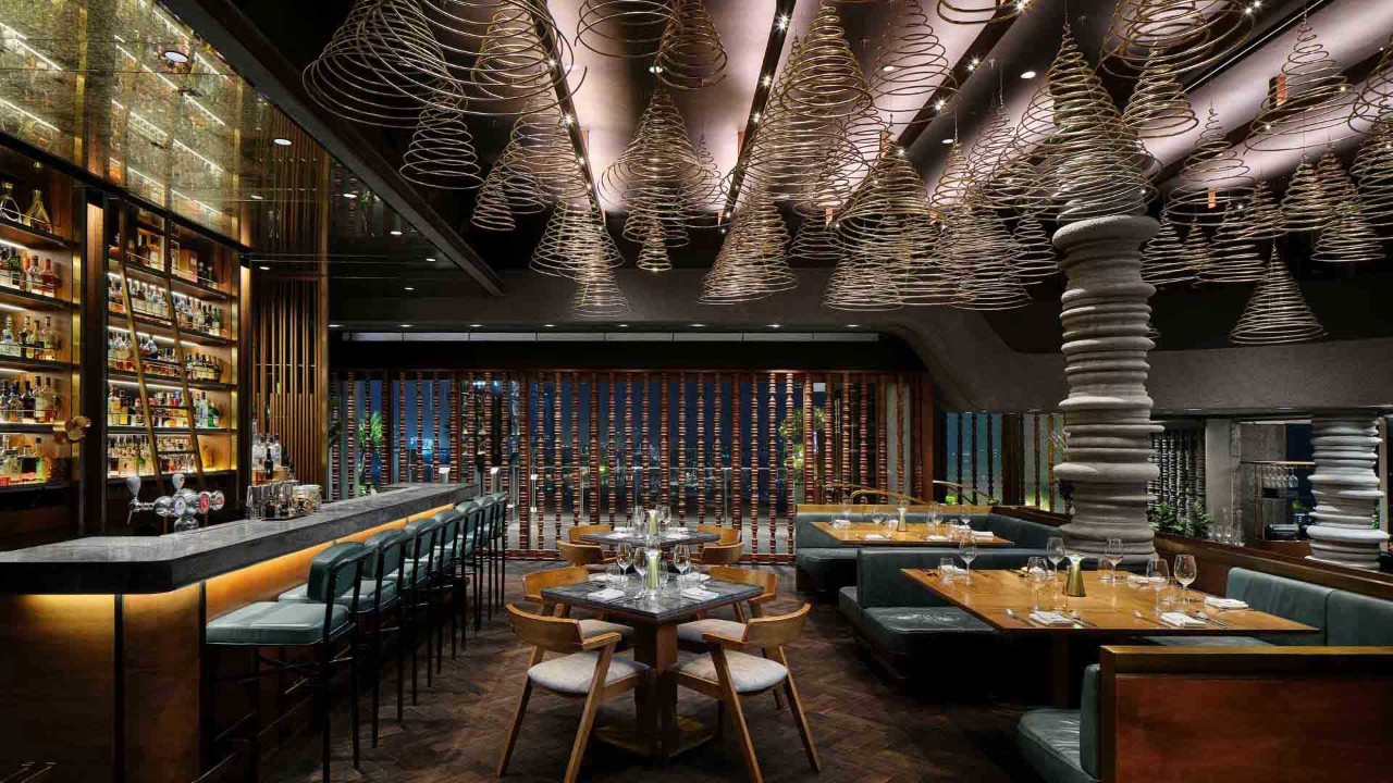 A rooftop dining restaurant with a view of downtown Singapore